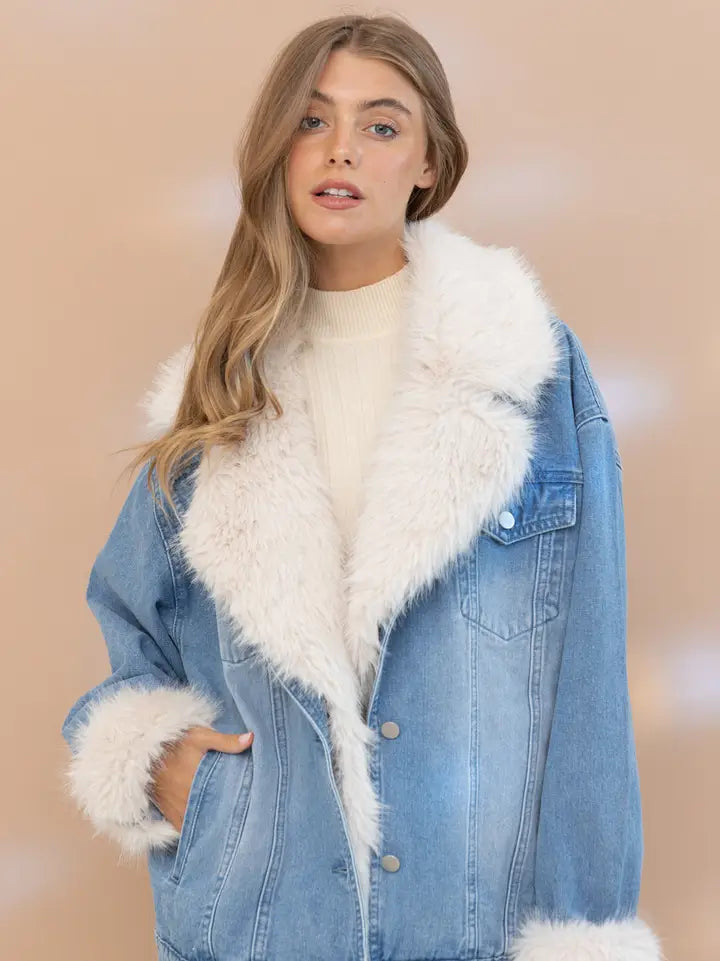 Fur-collared denim jacket on model; oversized blue denim with white faux fur trim, pre-order.